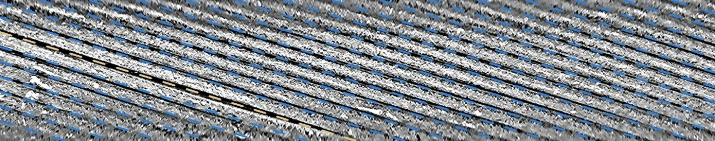 The frame unwrapped onto viewing angle and axial position, with the fitted helix lattice drawn as dashed parallel lines over every groove; the line over the opened groove at the left is tan.